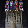 Dans la chapelle des Saints-Patrons, trois statues (saint Vincent, Trinité et saint Germain) formant retable (XIX ème siècle)